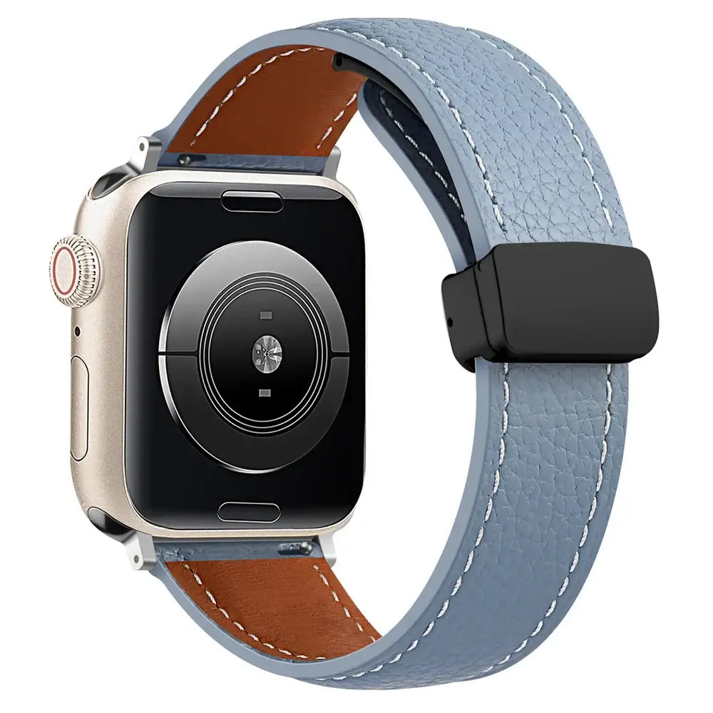 Stitched leather Apple Watch band in Dusty Blue, with black folding clasp.