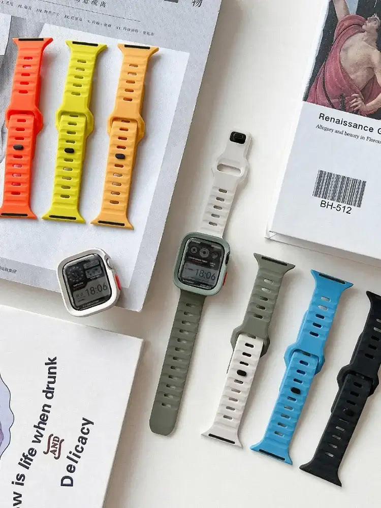 Apple Watch silicone bands and bumper cases in several colors.