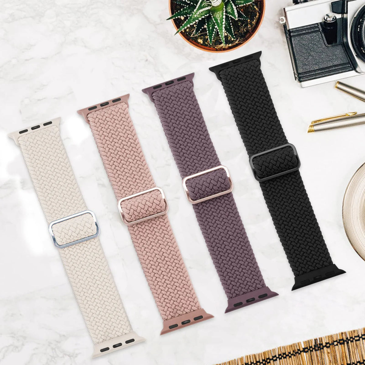 Four braided nylon Apple Watch loops laid flat
