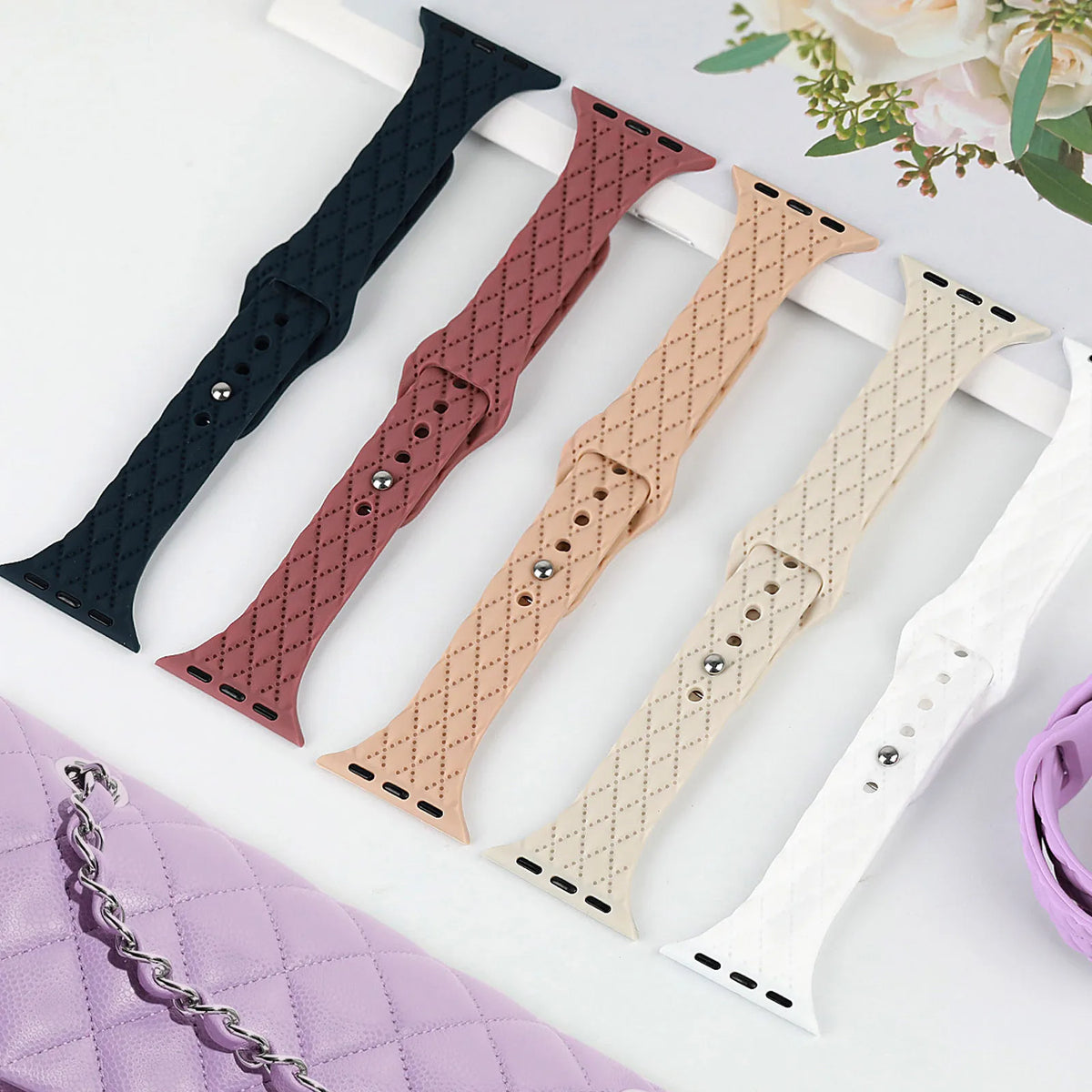 Slim diamond-pattern straps displayed in multiple colors for Apple Watch