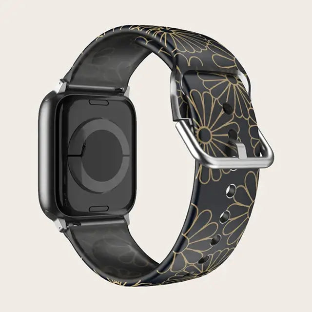 Black / Gold Floral Apple Watch band with buckle and adjustment holes.