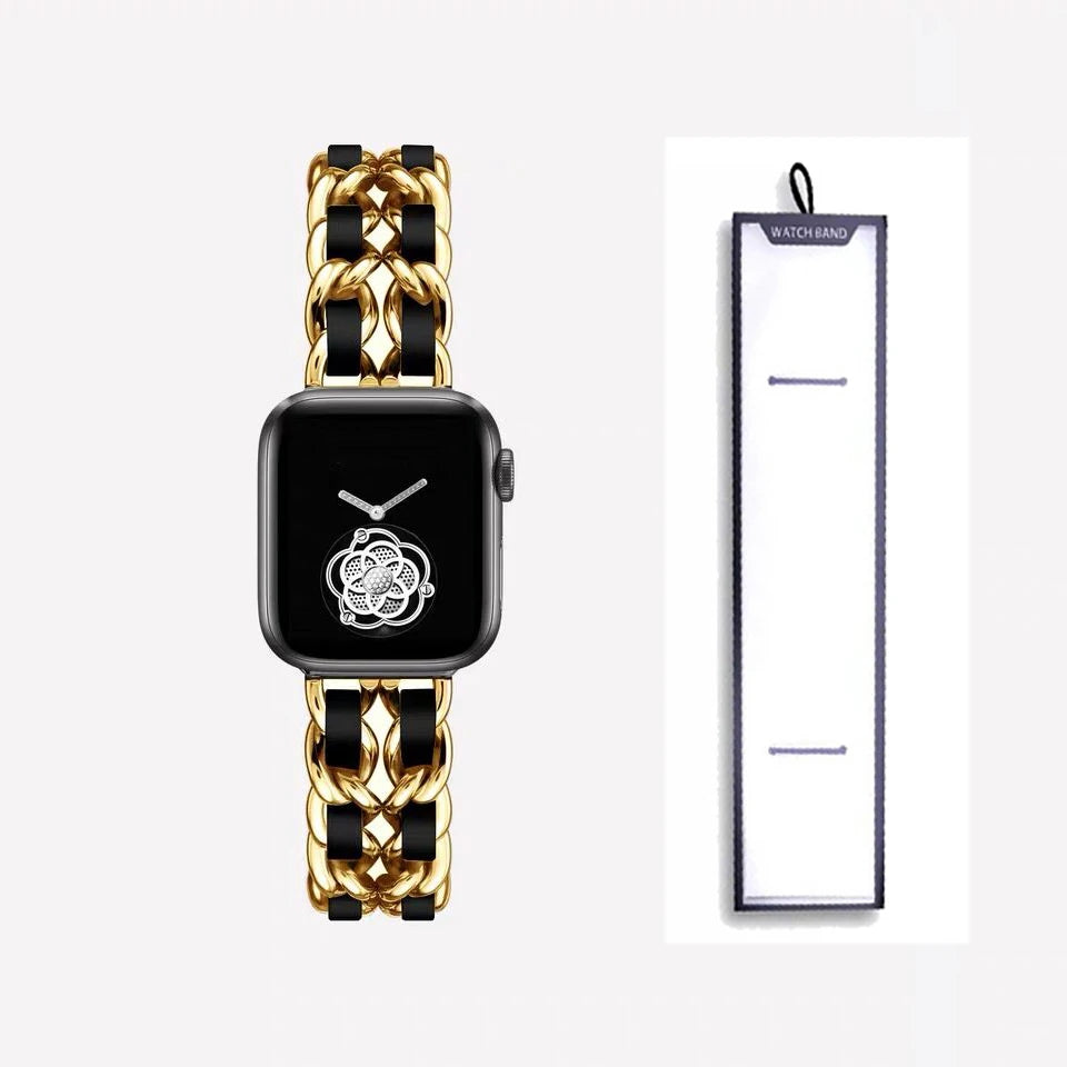 Gold chain bracelet with black accents, shown beside packaging for Apple Watch