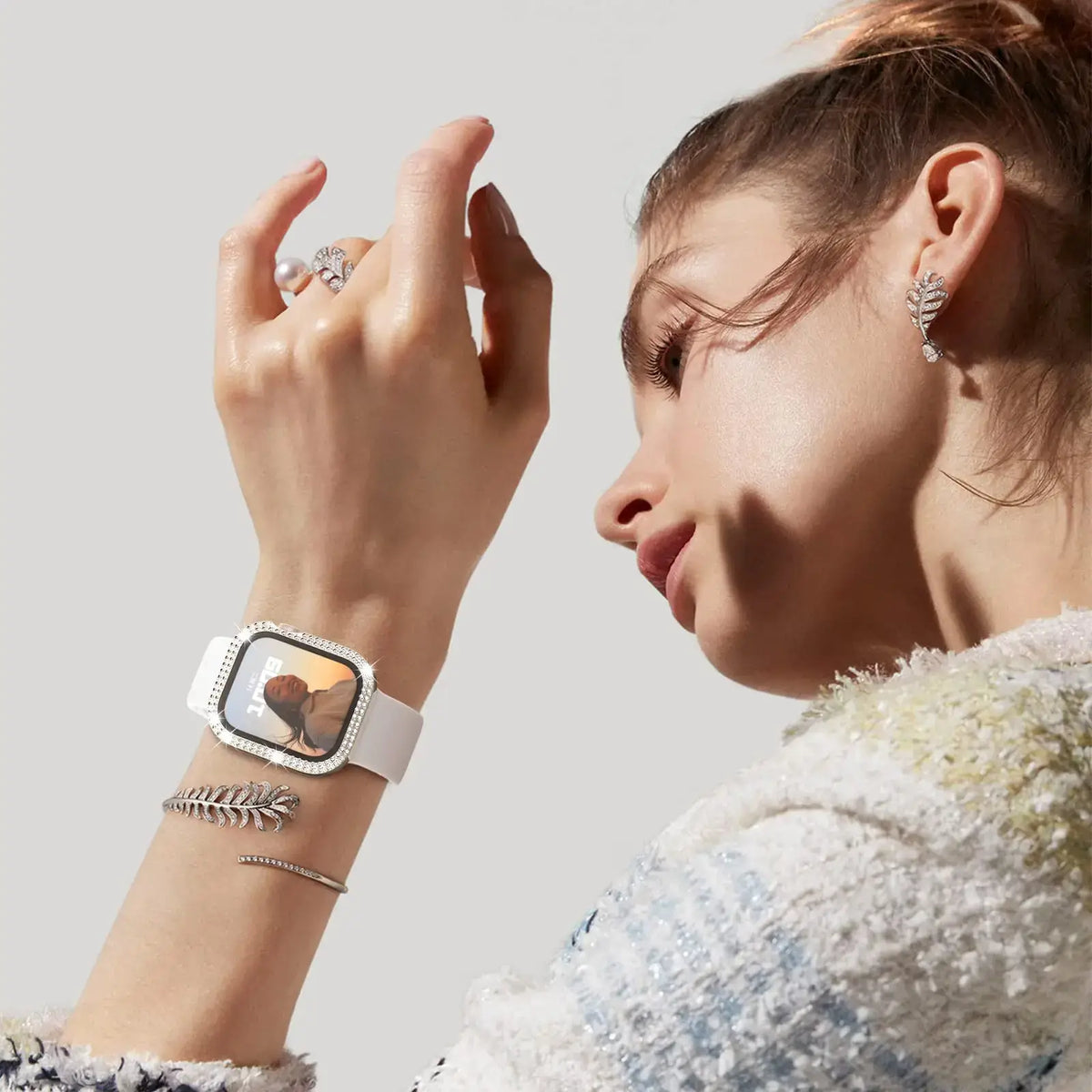 Dazzling Apple Watch case showcased on a stylish model, highlighting elegance and fashion for daily wear.