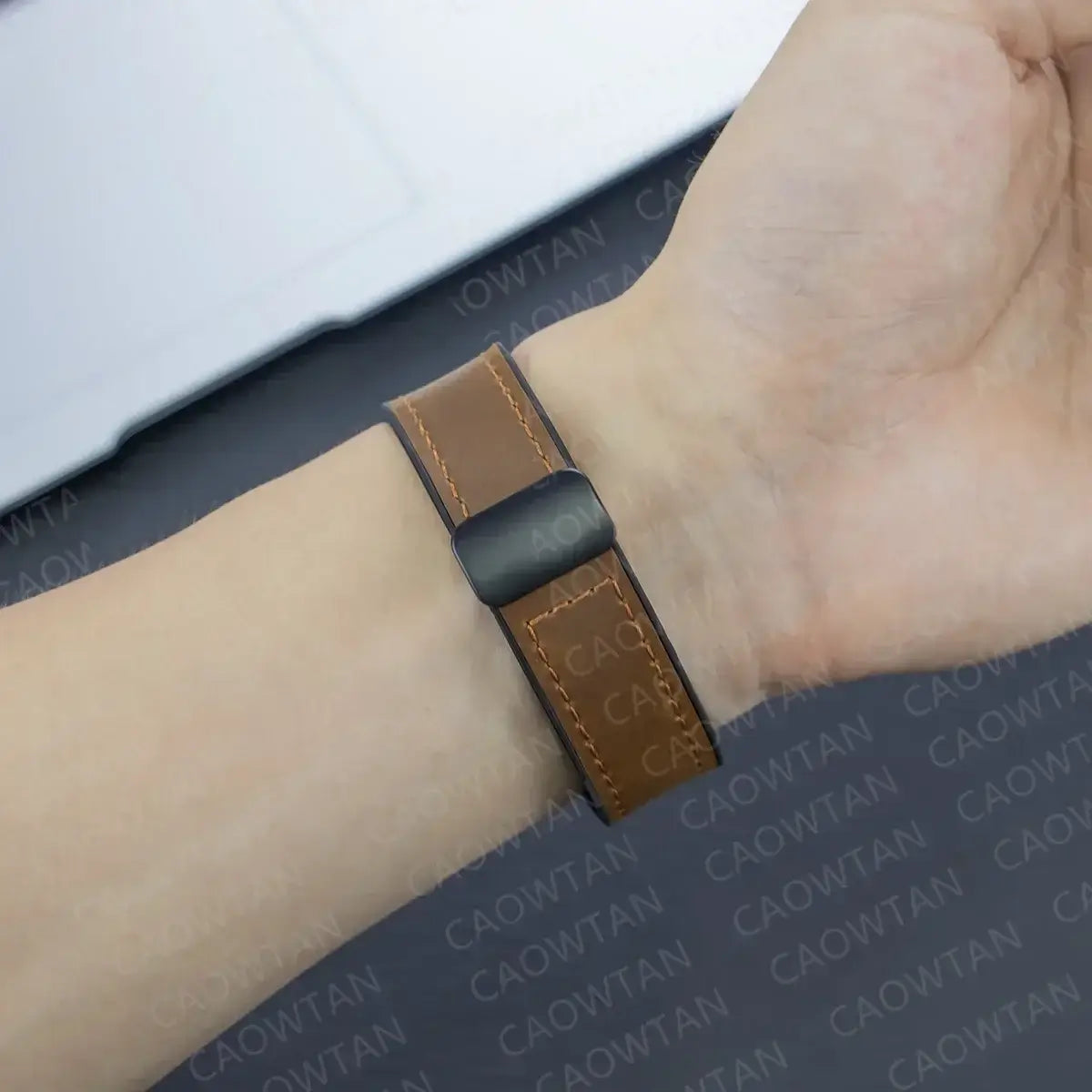 Garmin QuickFit Magnetic Leather Band tan strap shown on a wrist