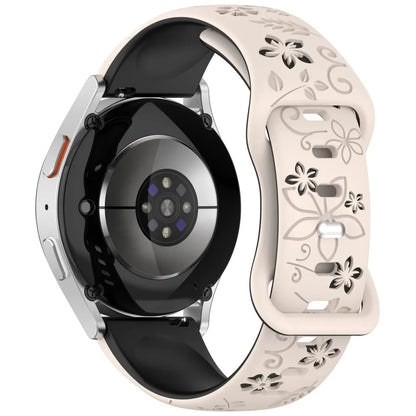 Garmin Floral Engraved Silicone Band in black and starlight on a watch