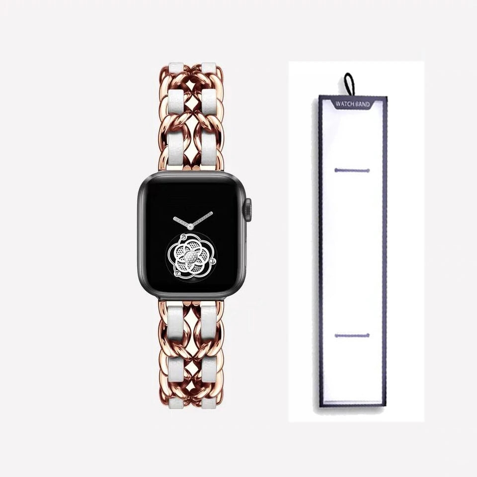 Rose gold chain bracelet with white accents, shown beside packaging for Apple Watch