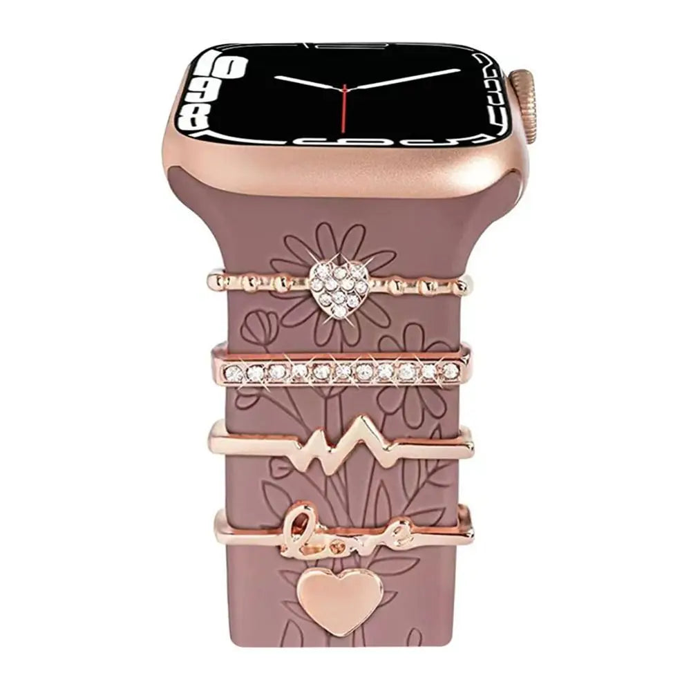 Elegant Apple Watch band with decorative metal charms, featuring hearts and sparkling accents for a stylish look.
