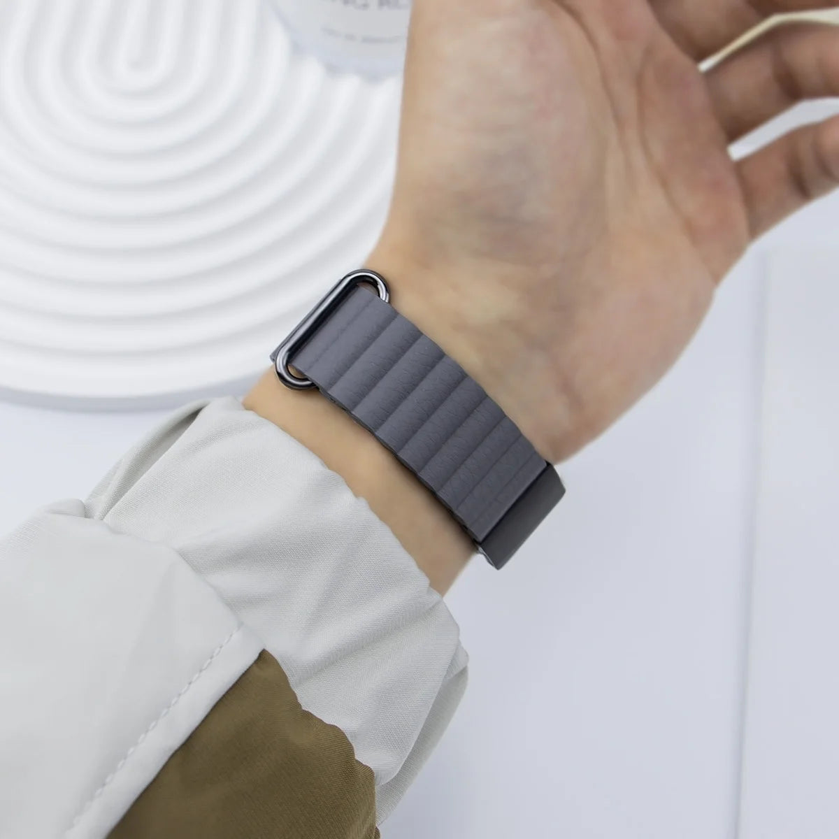 Garmin QuickFit Ribbed Magnetic Leather Band gray ribbed strap shown on a wrist