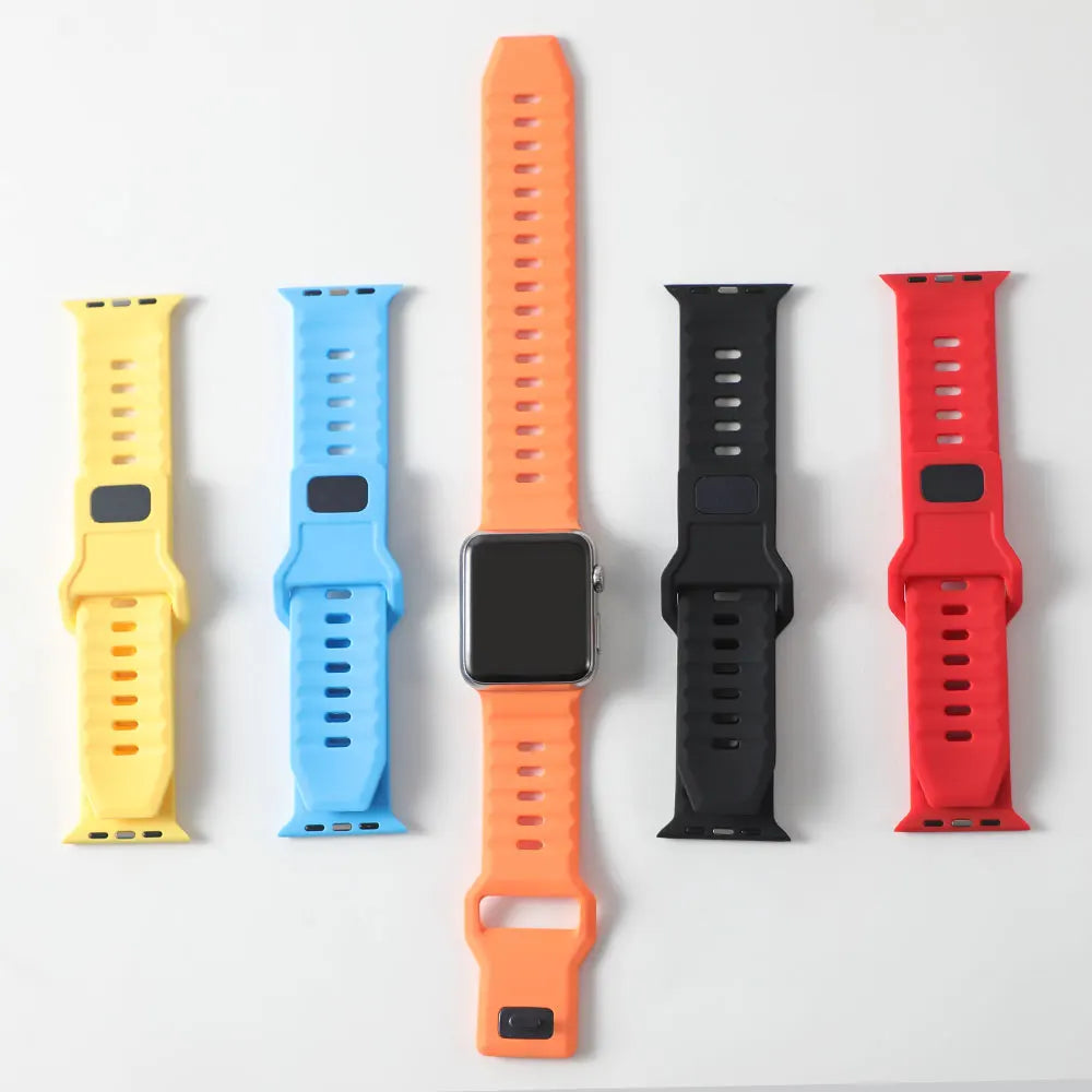 Five slotted silicone bands displayed together for Apple Watch