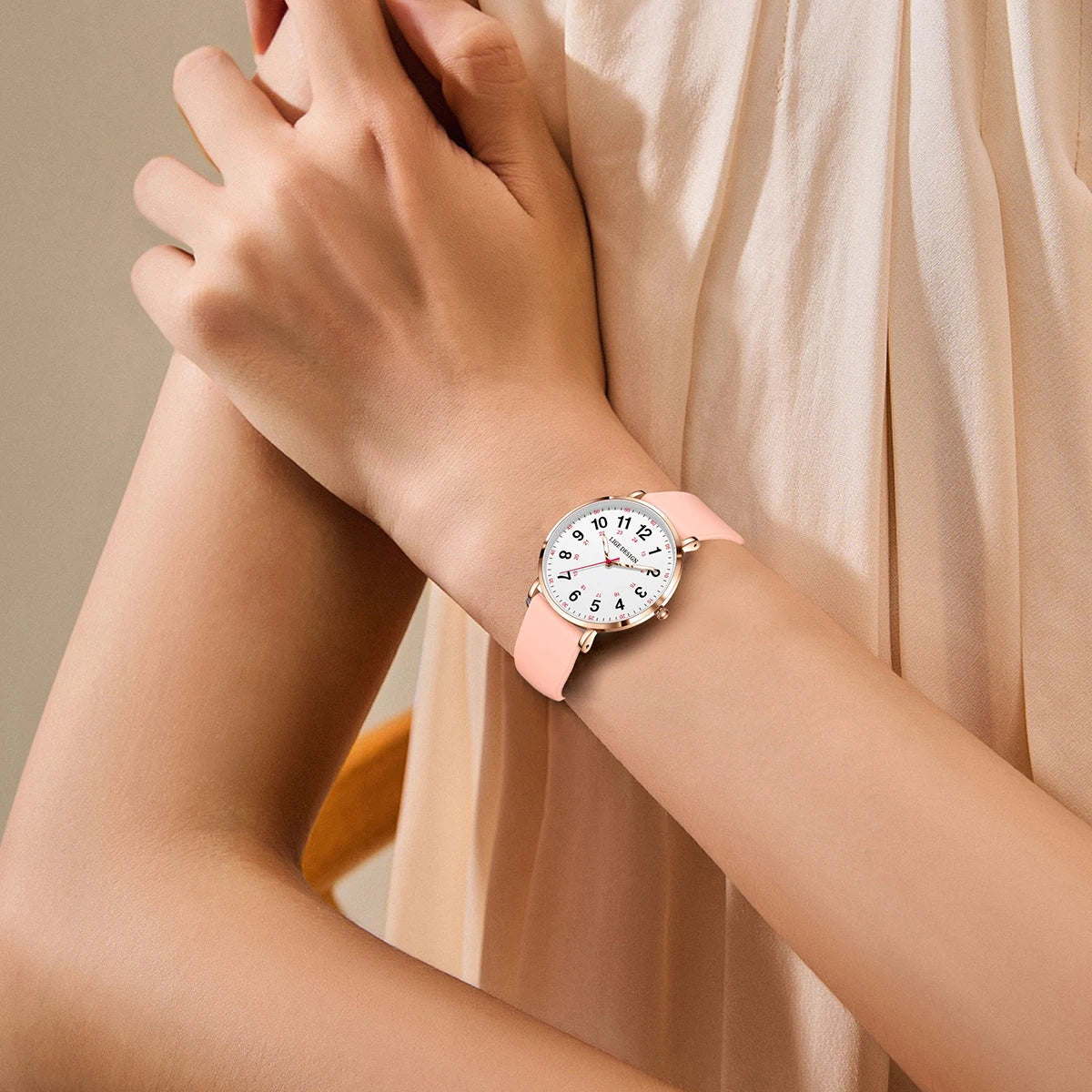 Women's Arabic Numeral Silicone Quartz Watch — Pink watch worn on wrist — BandsCo Straps