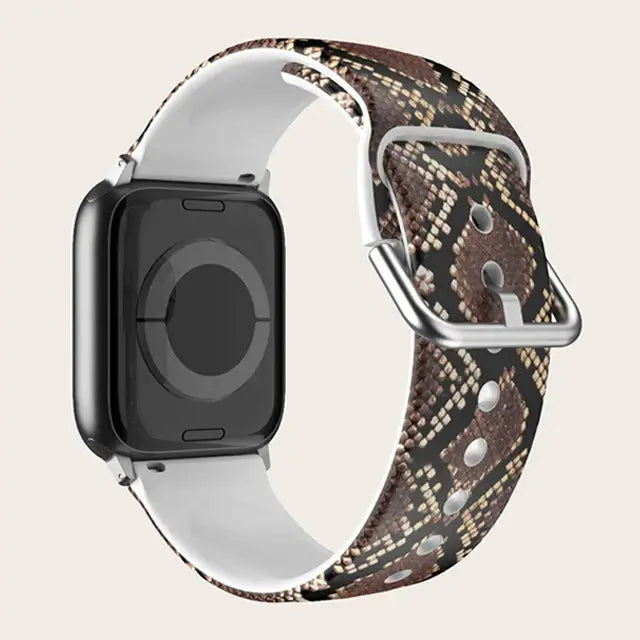 Brown Snakeskin Apple Watch band with buckle and adjustment holes.