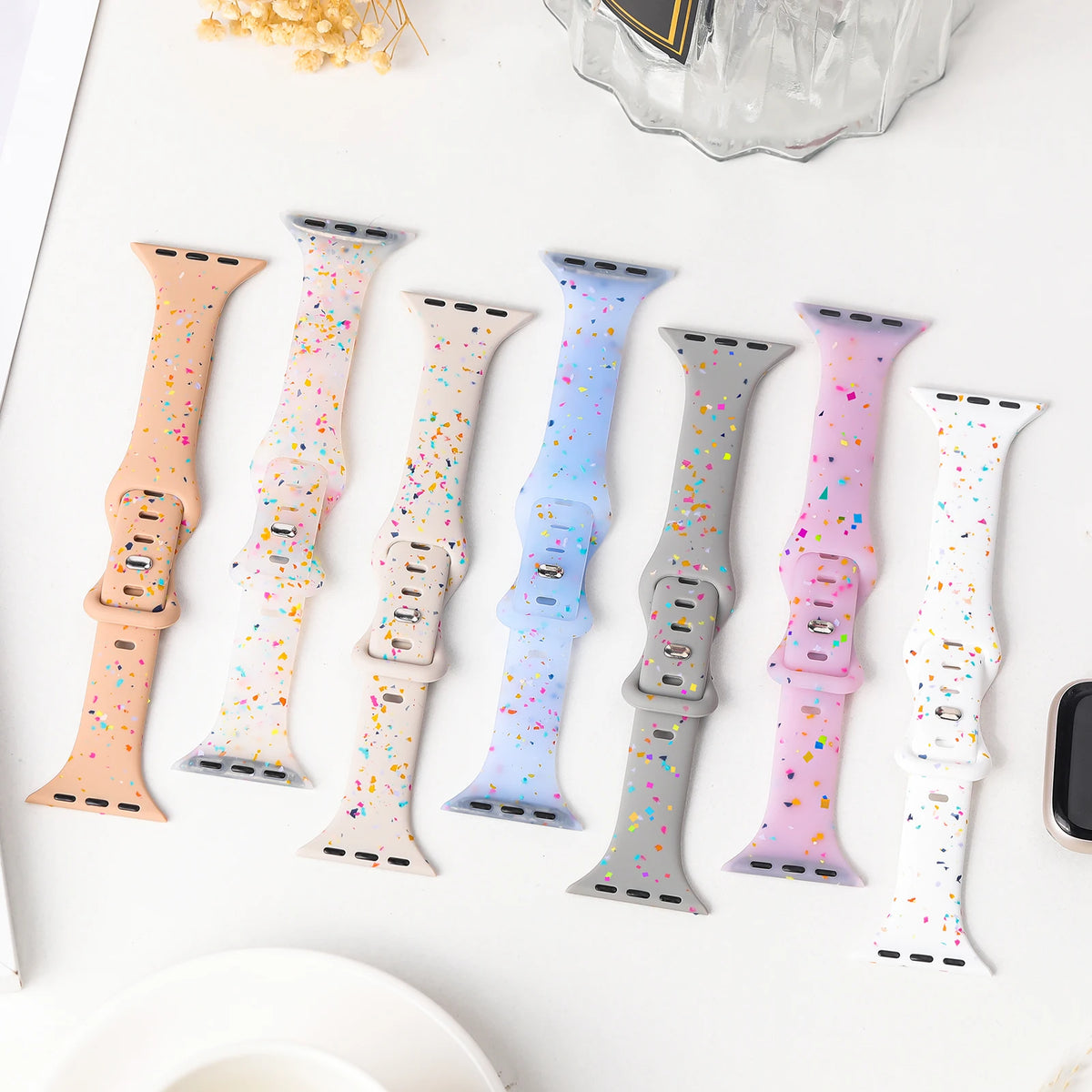 Confetti-speckle straps displayed in multiple colors for Apple Watch