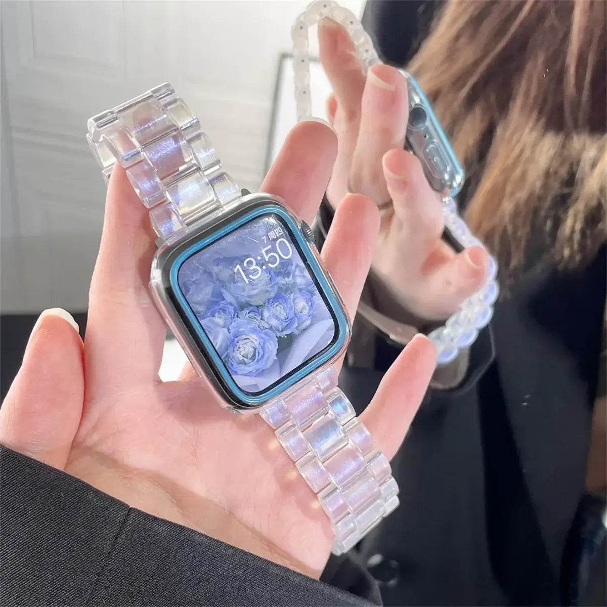 Iridescent blue resin Apple Watch band held in hand