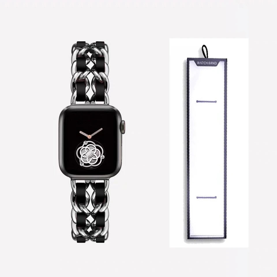 Silver chain bracelet with black accents, shown beside packaging for Apple Watch