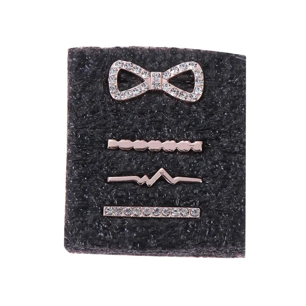 Set of decorative metal charms for Apple Watch bands, featuring sparkling designs including a bow and wavy patterns.