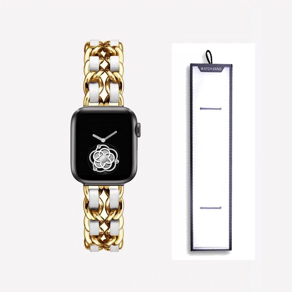 Gold chain bracelet with white accents, shown beside packaging for Apple Watch