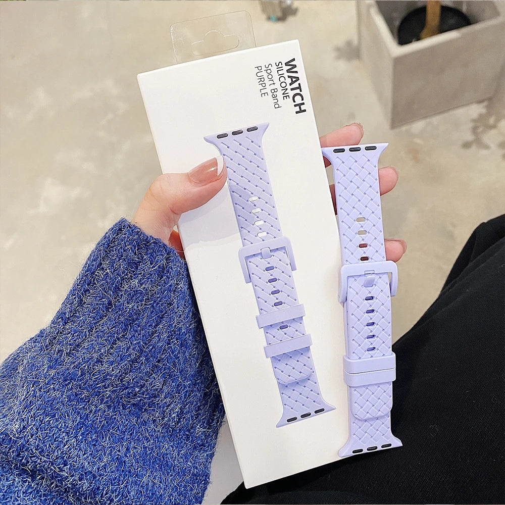 Lilac basketweave strap held beside its display card for Apple Watch