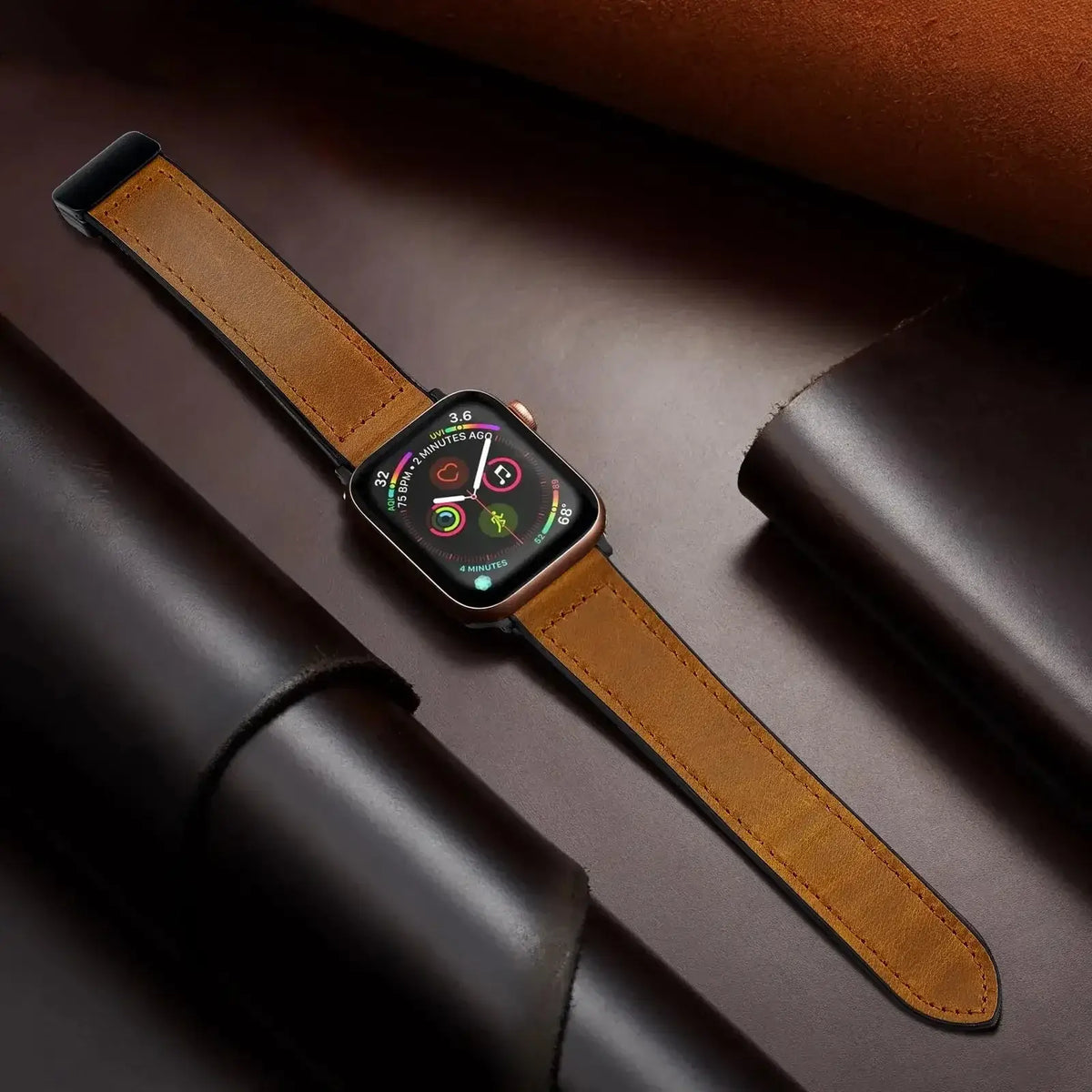 Tan stitched leather Apple Watch band laid flat
