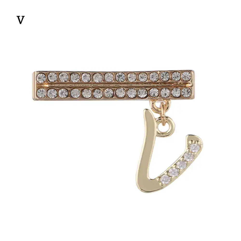 Decorative letter charm for Apple Watch band featuring gold accents and sparkling rhinestones, stylish and luxurious.