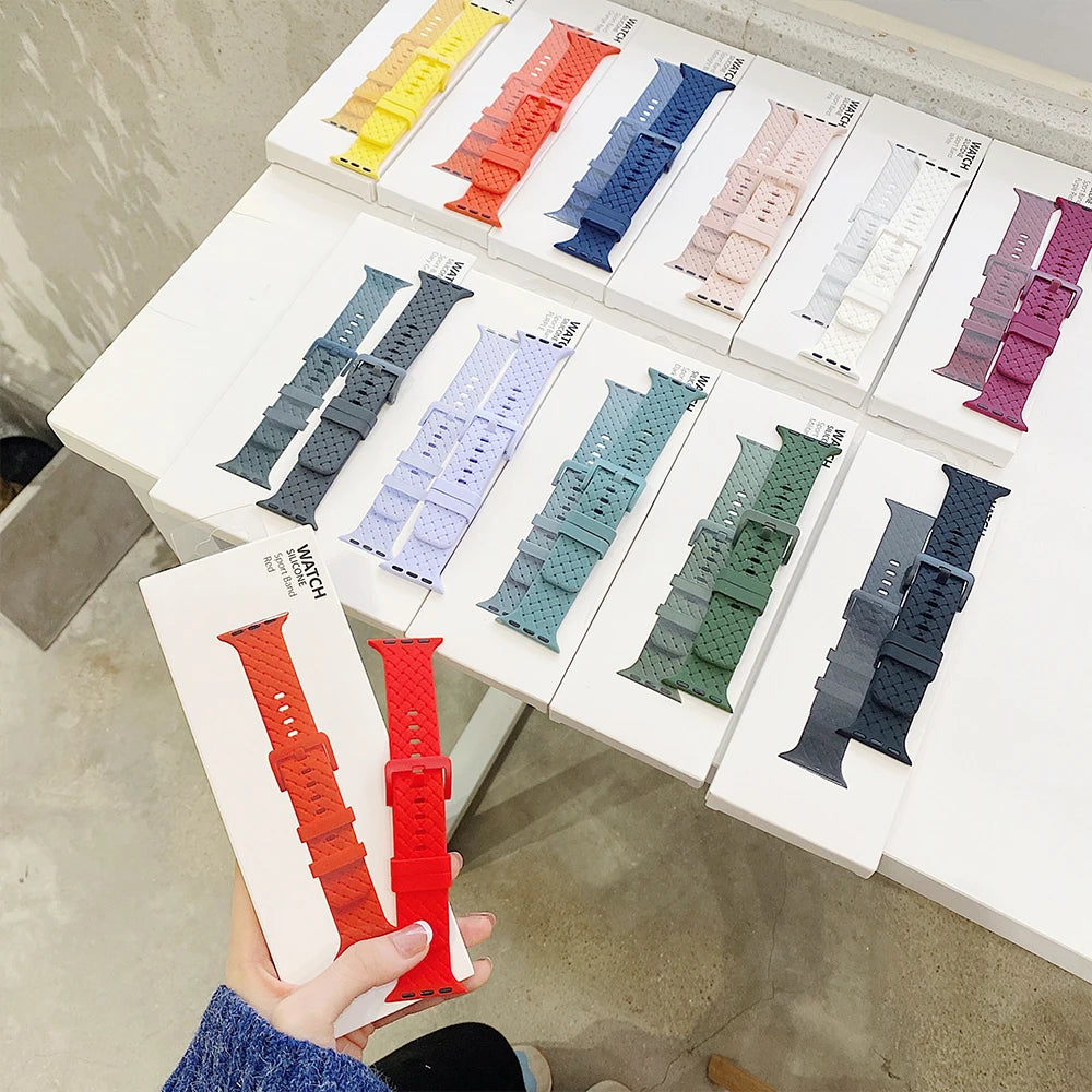 Assorted basketweave-texture straps on display cards for Apple Watch