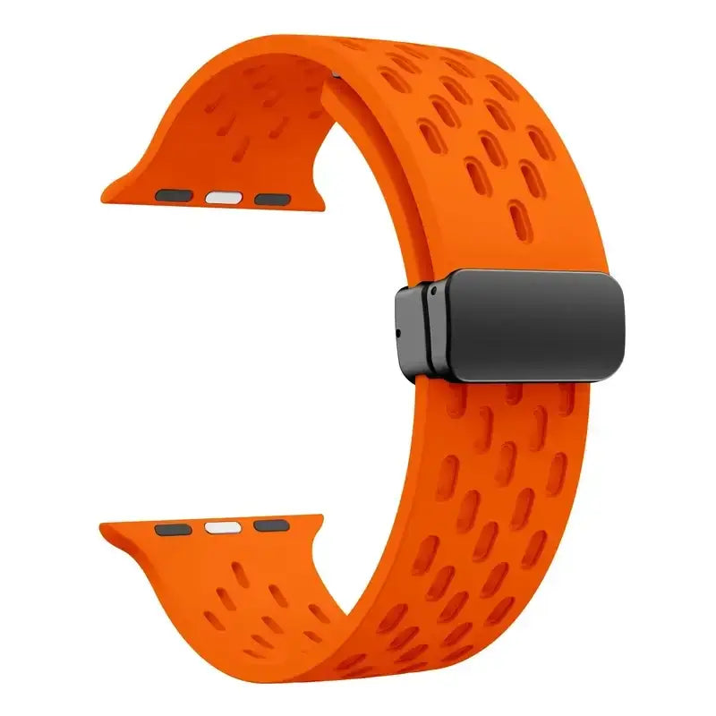 Orange perforated silicone Apple Watch band with magnetic clasp