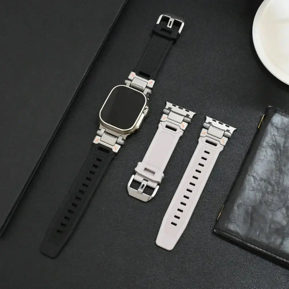 Black, beige and clear silicone Apple Watch straps laid flat