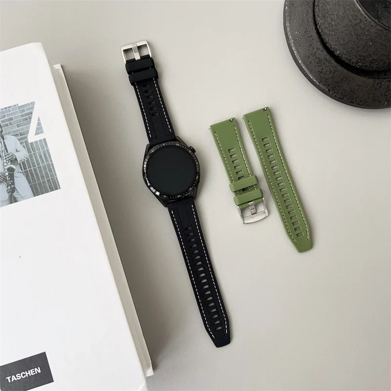 OnePlus Smartwatch Silicone Watch Band Breathable Sport Strap Replacement next to a stylish watch on a flat surface.