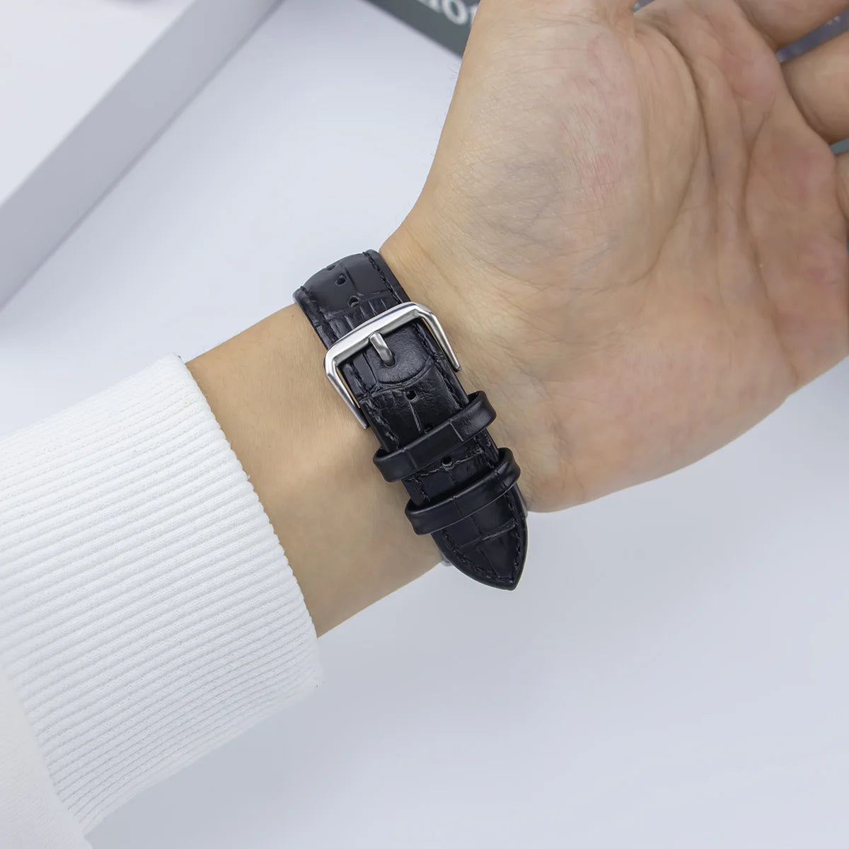 Garmin QuickFit Croc-Embossed Leather Band black embossed leather band shown on a wrist