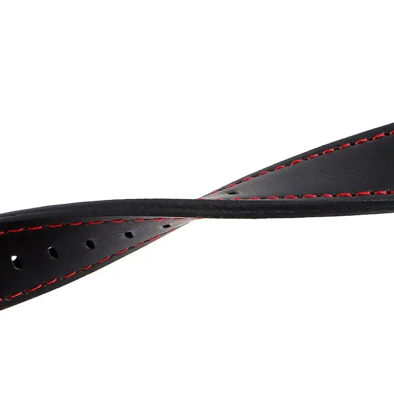 Black leather strap with red stitching bent to show flexibility