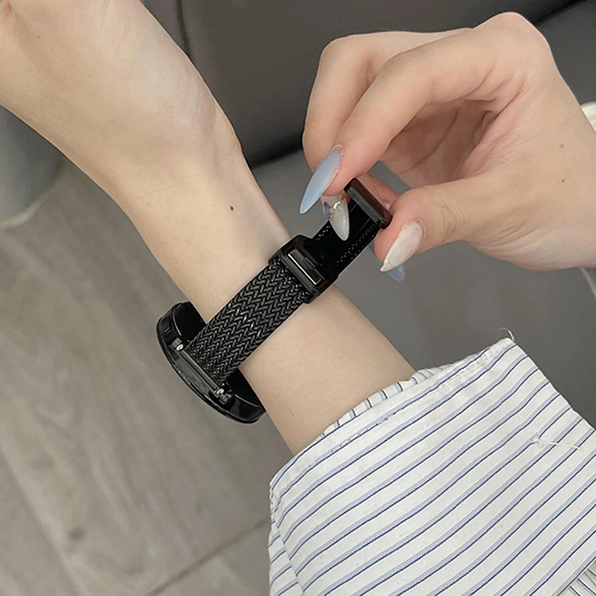 Garmin Slim Magnetic Metal Mesh Band in black worn on a wrist
