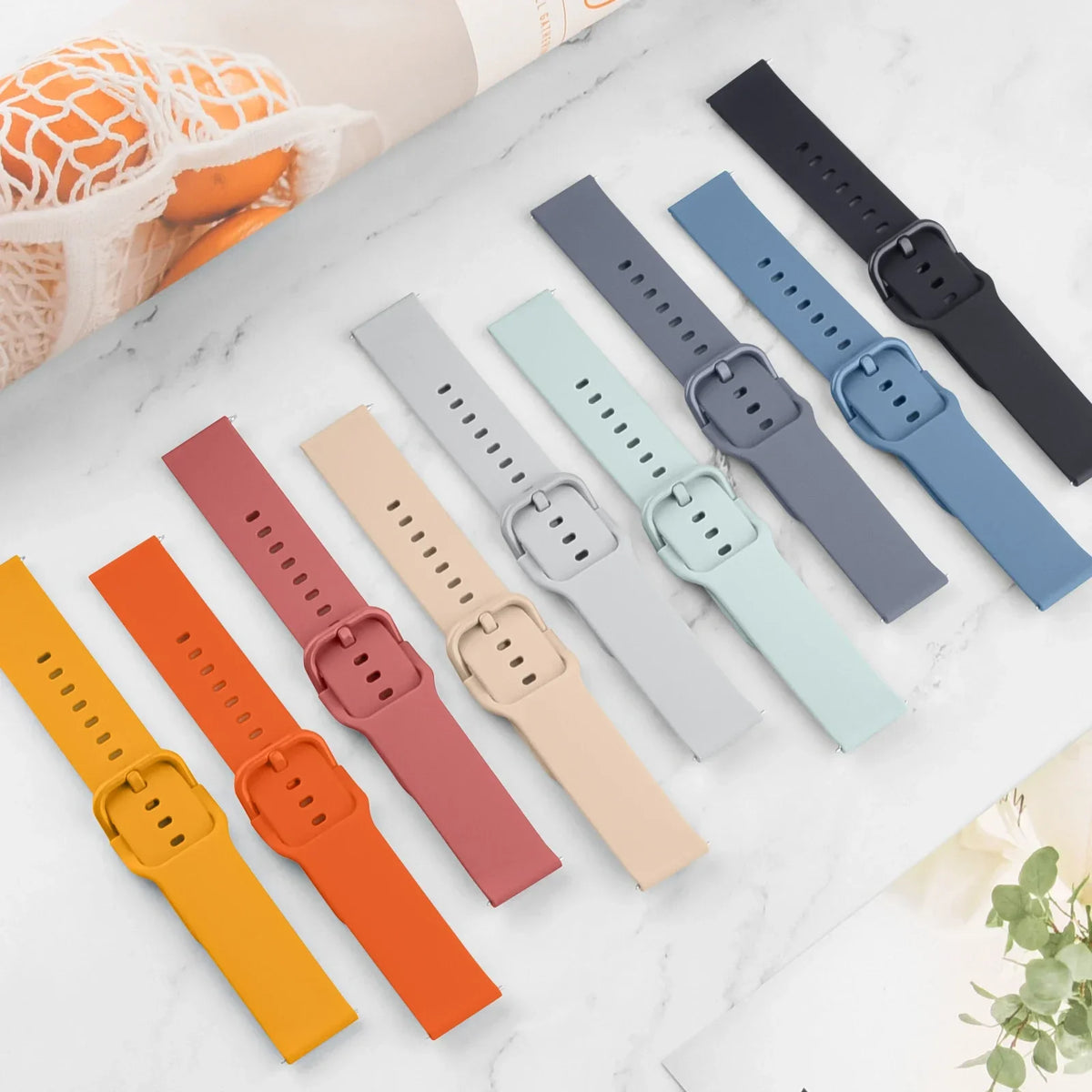 OnePlus Watch Band Silicone Strap Sport Replacement Wristband Accessory in various colors displayed on a marble surface.