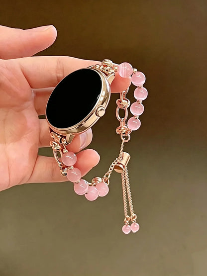 Garmin Women's Pearl Chain Bracelet in pink held in hand