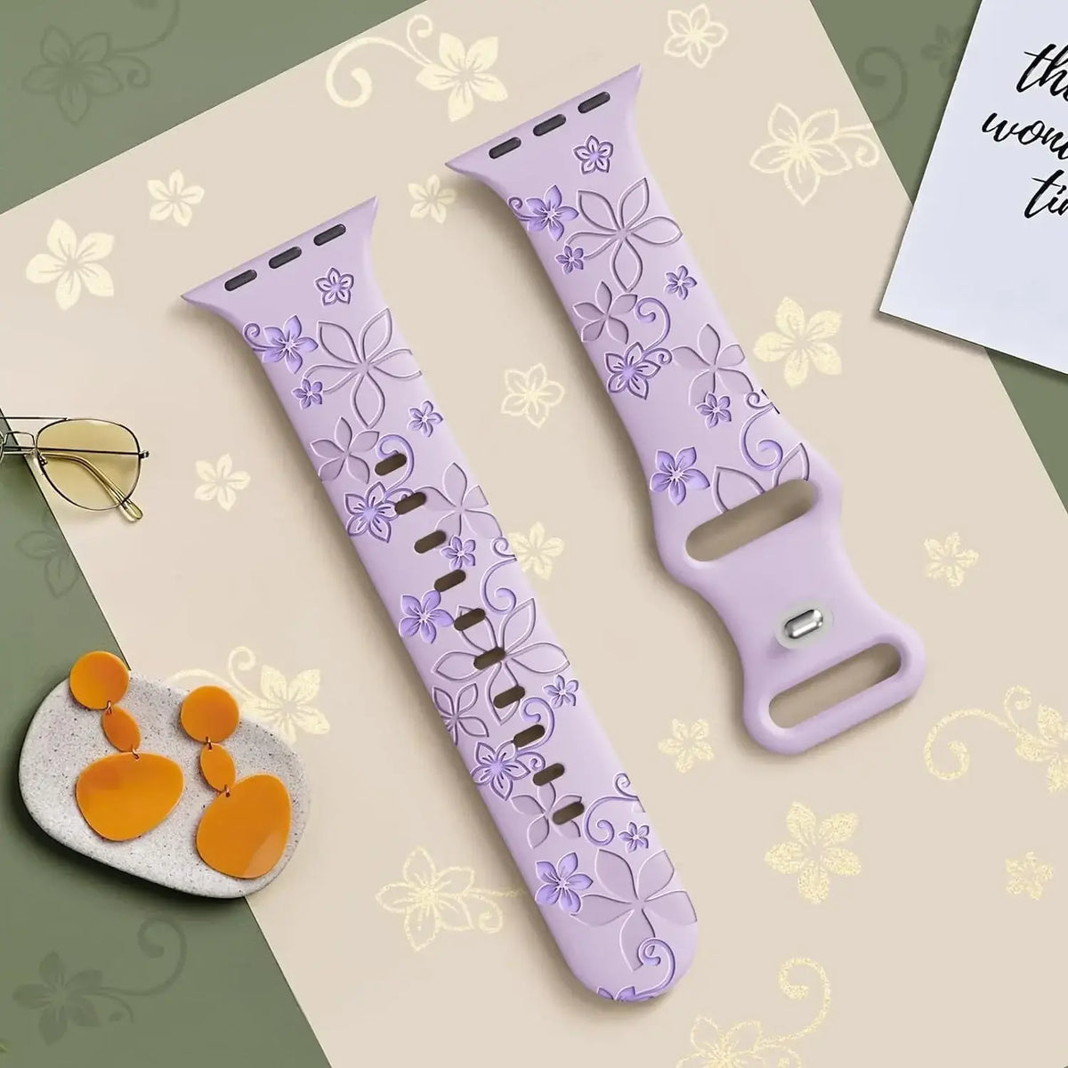 Lilac and lavender floral silicone Apple Watch strap laid flat