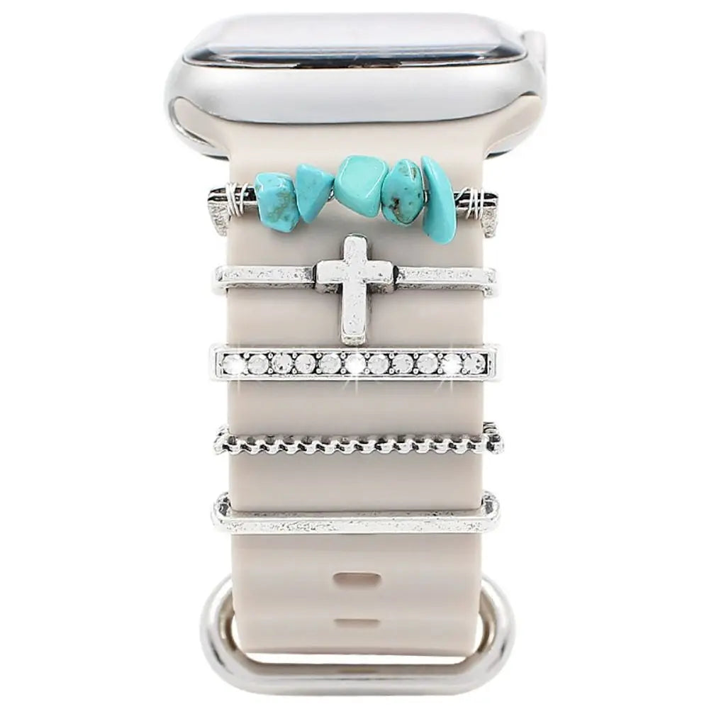 Decorative metal charms for Apple Watch bands, featuring turquoise and silver accents for a stylish look.