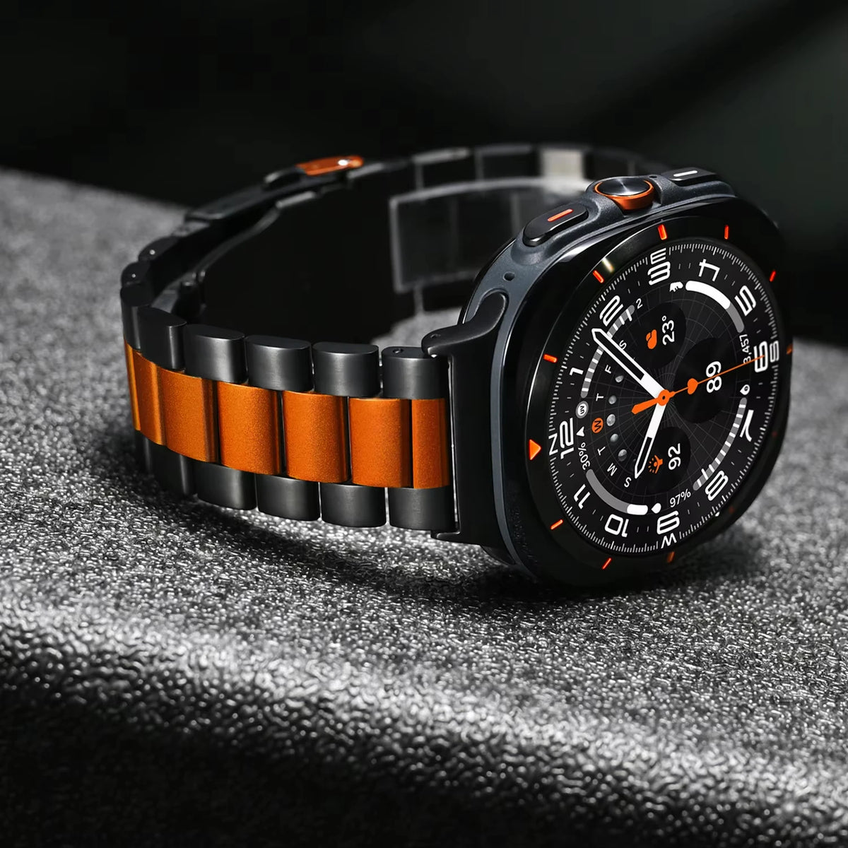 Samsung Galaxy Stainless Steel Link Watch Band - Ultra/Ultra2 on a stylish smartwatch with a black and orange design.