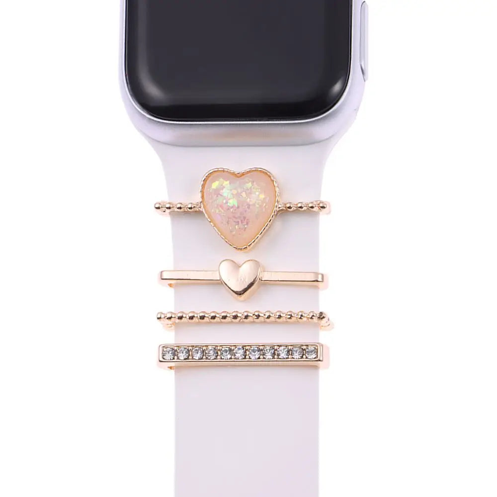 Decorative metal charms for Apple Watch bands featuring heart and rhinestone designs, adding elegance to your smartwatch.