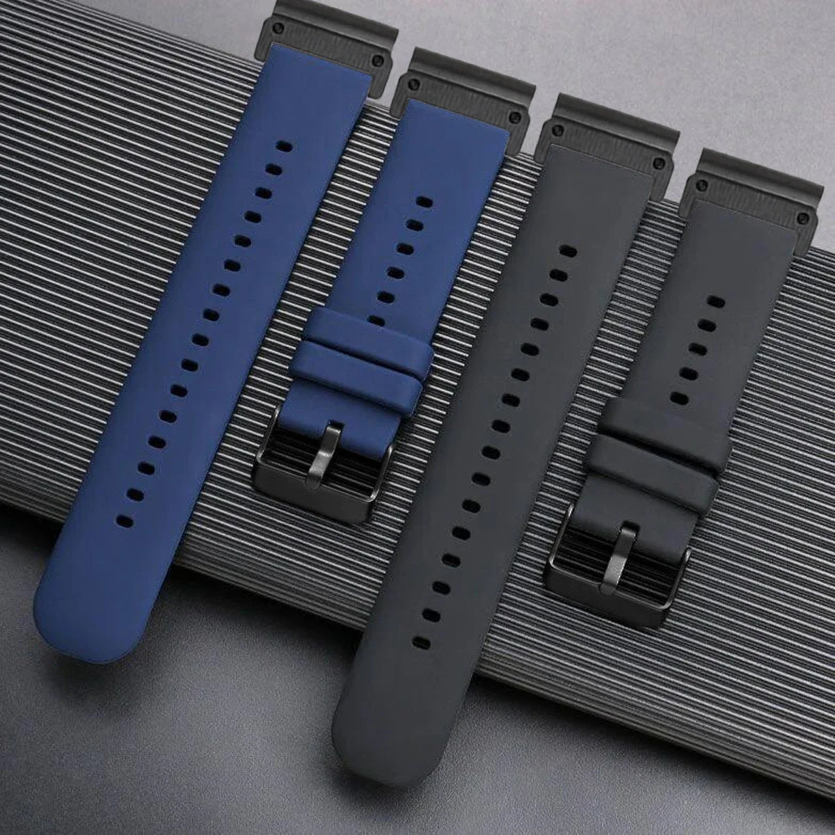 Garmin QuickFit Smooth Silicone Buckle Band navy, gray and black straps laid flat