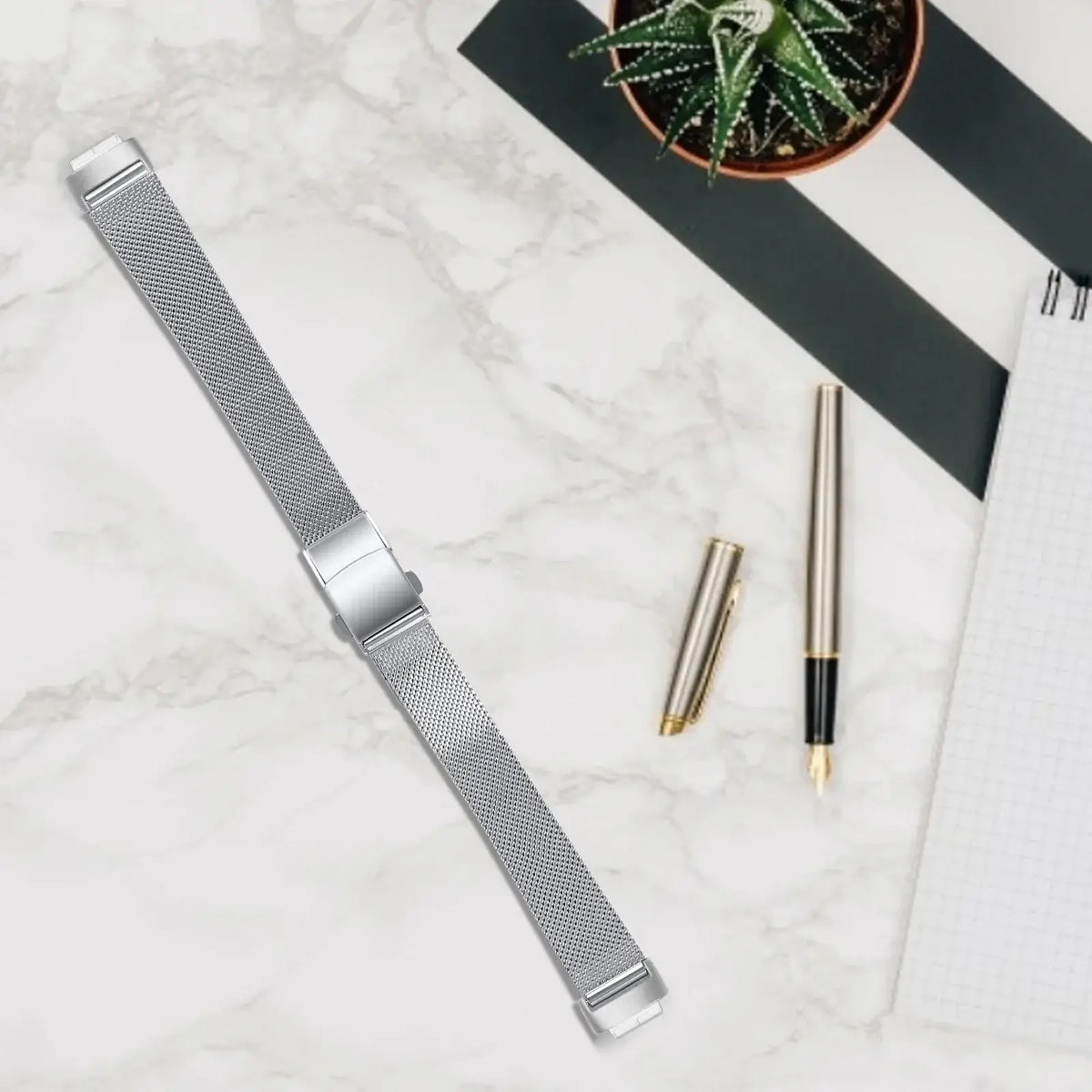 Fitbit Inspire 3 Stainless Steel Mesh Clasp Band - Silver mesh strap laid flat