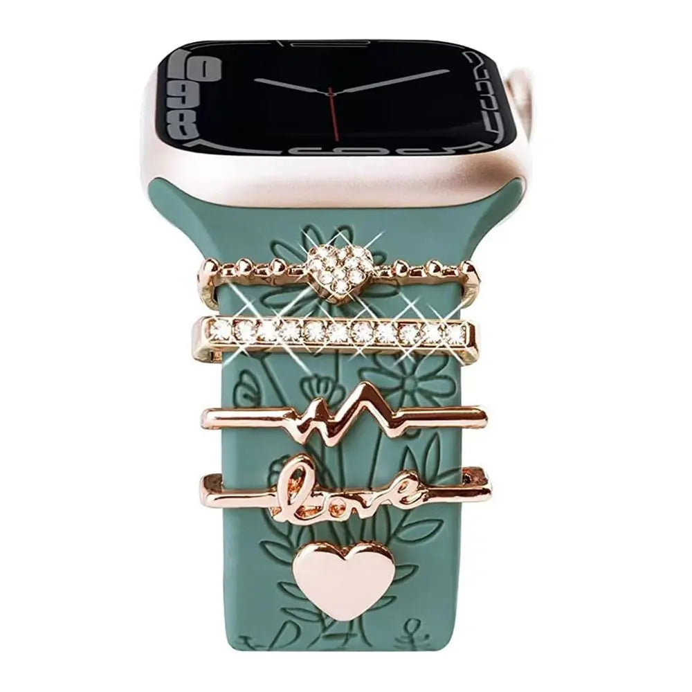 Elegant decorative metal charms on green Apple Watch band, adding style and personalization to smartwatch.