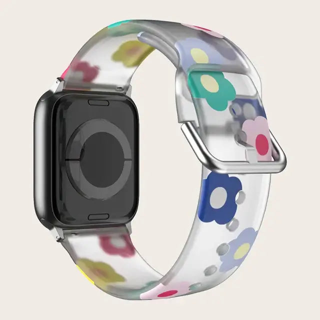 Clear Multicolor Floral Apple Watch band with buckle and adjustment holes.