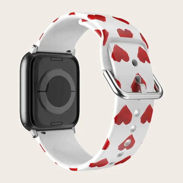 Red Hearts Apple Watch band with buckle and adjustment holes.