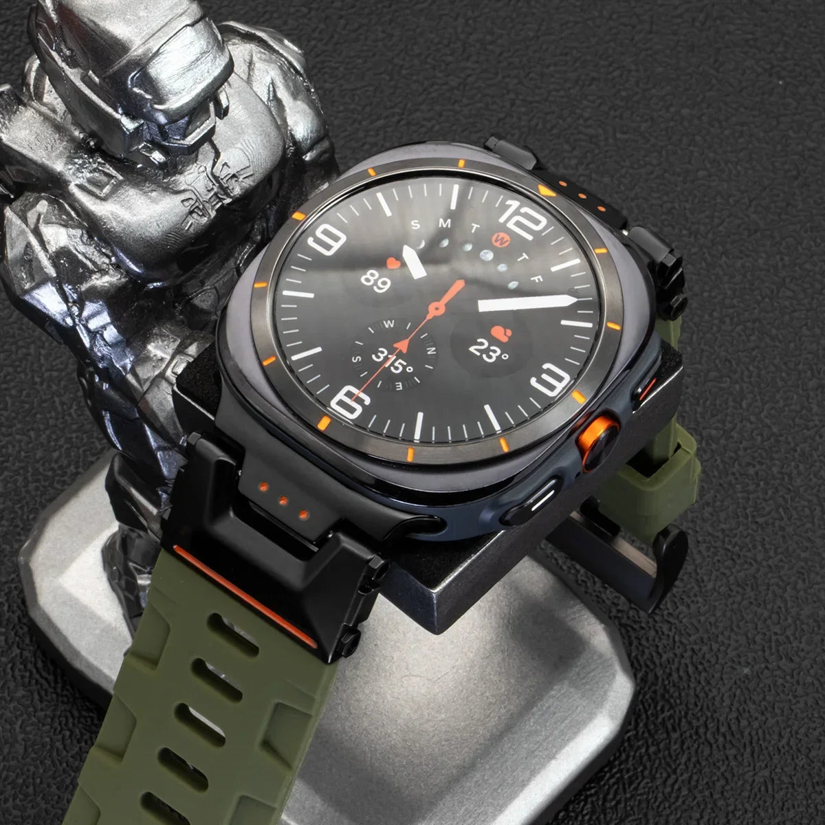 Samsung Galaxy Silicone Sport Watch Band - Ultra/Ultra2 No Gaps on a watch stand next to a figurine.