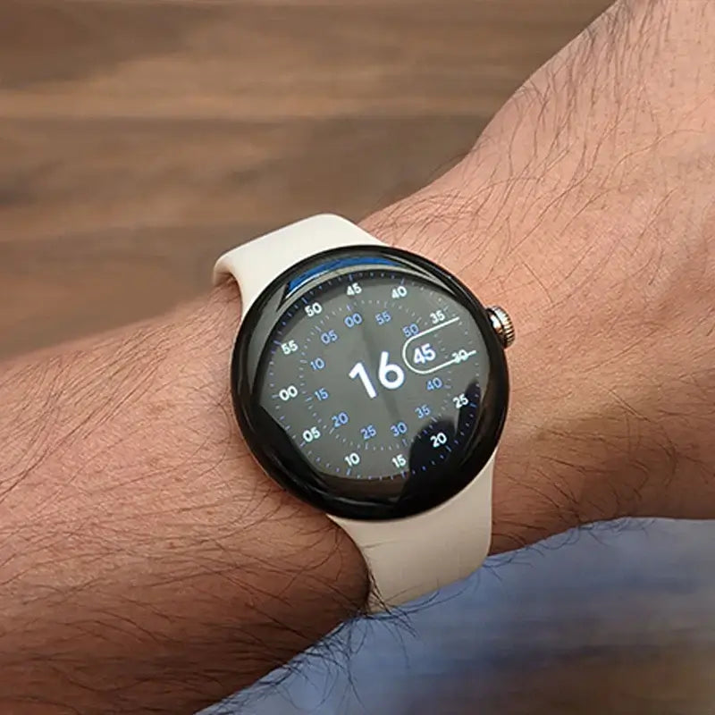 Ivory silicone Pixel Watch band worn on wrist
