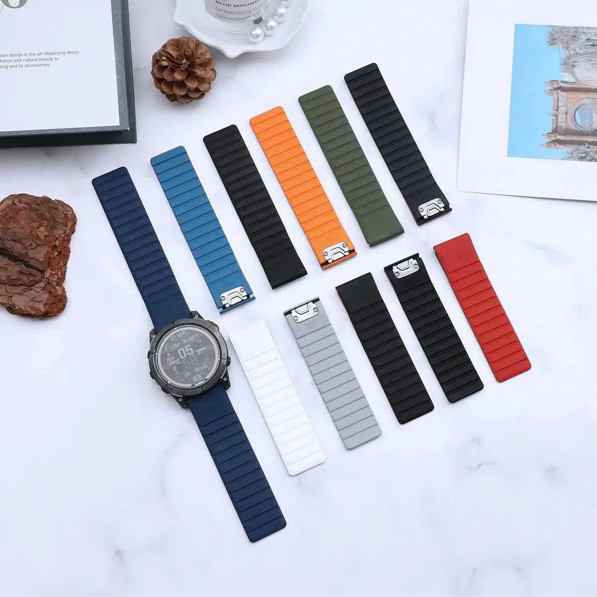 Garmin QuickFit Magnetic Silicone Wrap Band assorted two-tone straps laid flat beside a watch