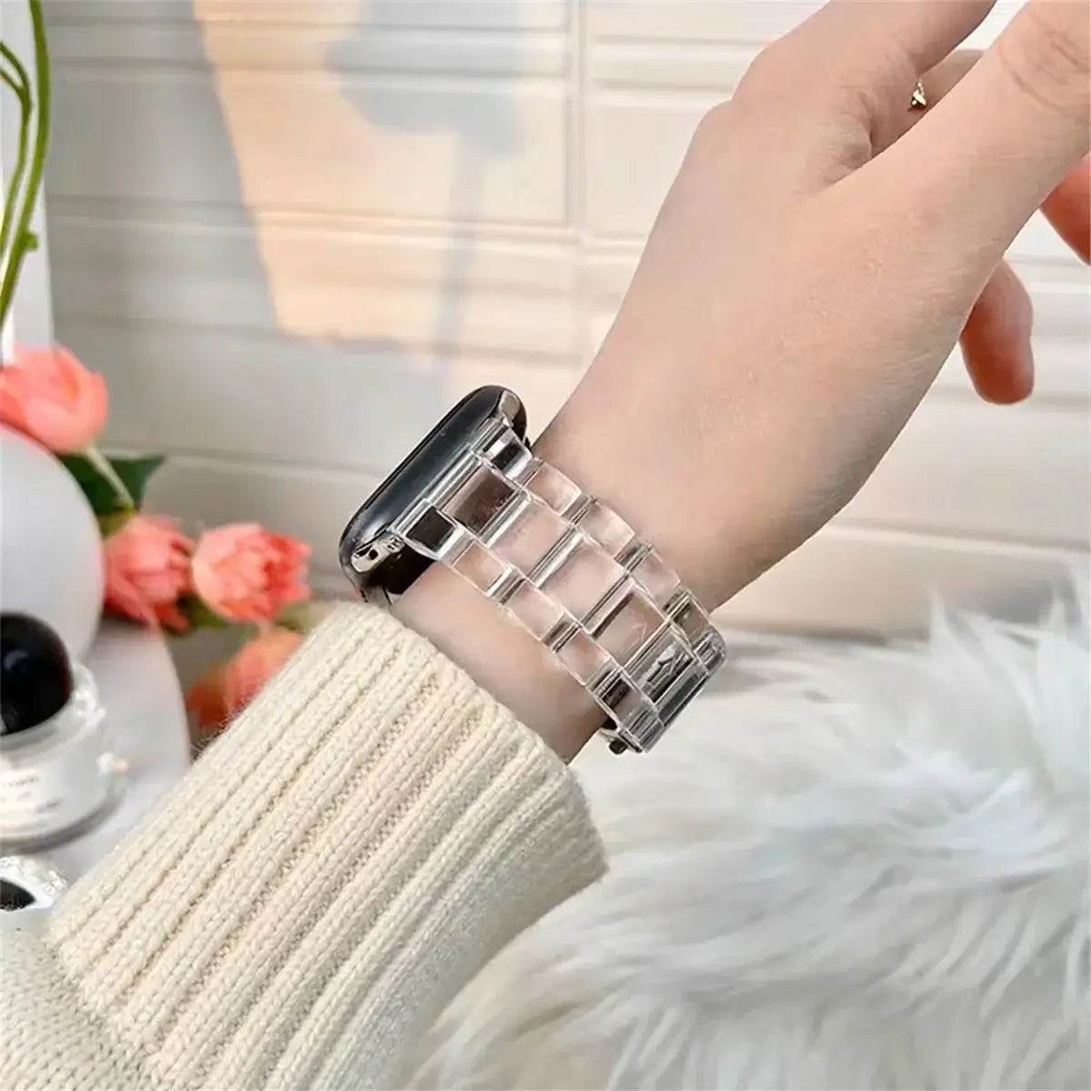 Clear resin Apple Watch band worn on wrist