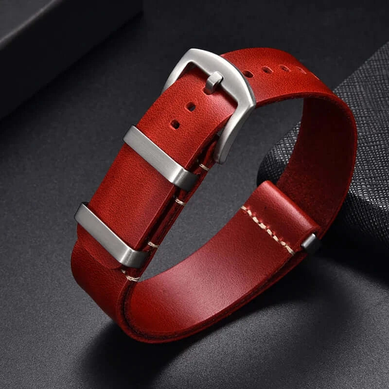 Red leather strap fastened with silver-tone hardware