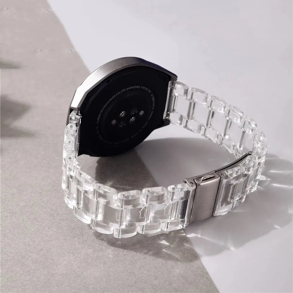 Samsung Galaxy Clear Plastic Link Watch Band – For Watch8/Watch8 Classic/Watch9/Ultra/Ultra2 on a grey surface.