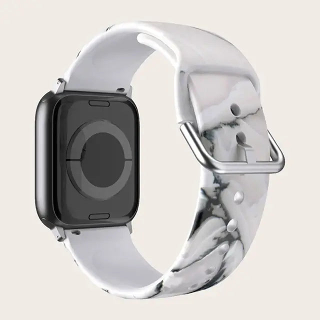 White Marble Apple Watch band with buckle and adjustment holes.