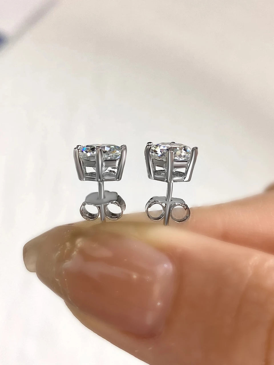 Six-Prong Moissanite Stud Earrings in Sterling Silver - silver baskets and butterfly backs