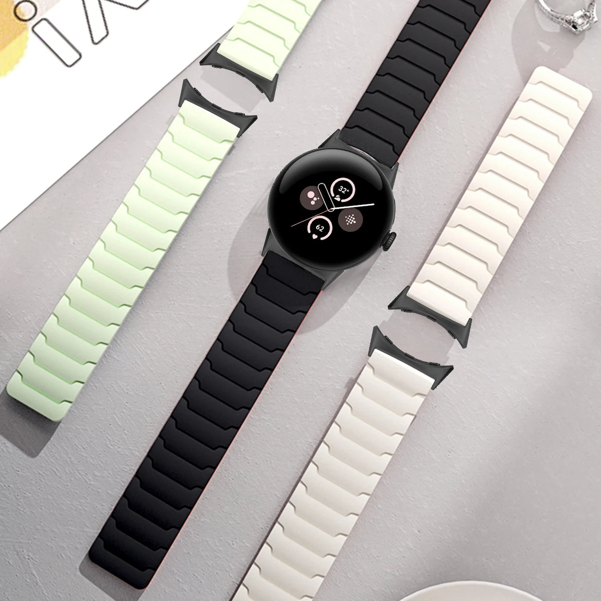 Several magnetic silicone Pixel Watch bands laid flat
